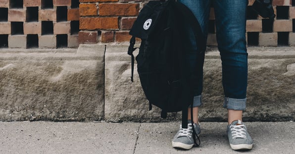 Student holding backpack