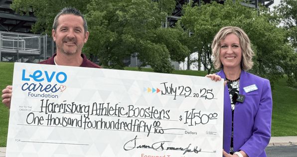 Levo shares with Harrisburg Athletic Boosters a check presentation