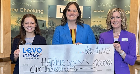 Levo Credit Union provides the Helpline Center with a financial gift.