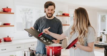 Man and woman cooking together