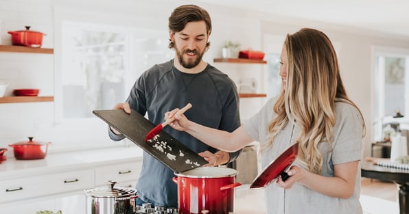 Man and woman cooking together