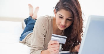 Woman looking at credit card
