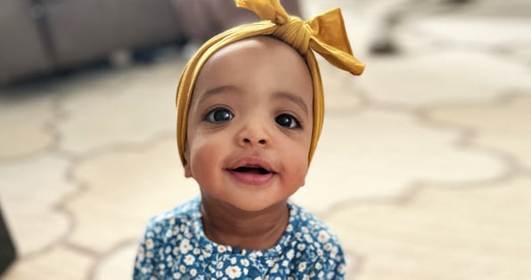 A little girl who was able to be adopted with the help of Levo Credit Union