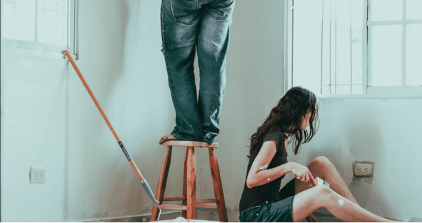 Two people painting