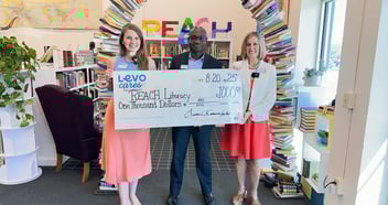 REACH Literacy receives a $1,000 donation from Levo Credit Union
