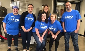 Group of smiling Levo volunteers