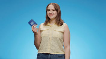 woman holding a Levo card