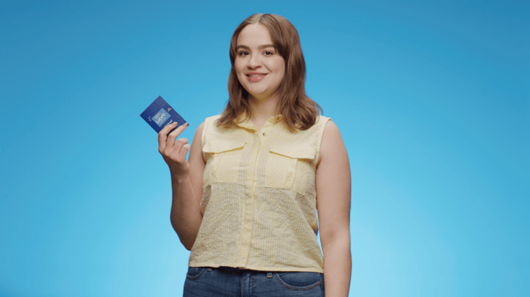 woman holding a Levo card