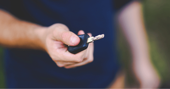 Someone holding car key