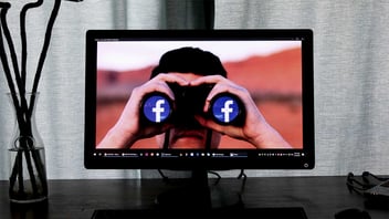 Man with binoculars on computer screen